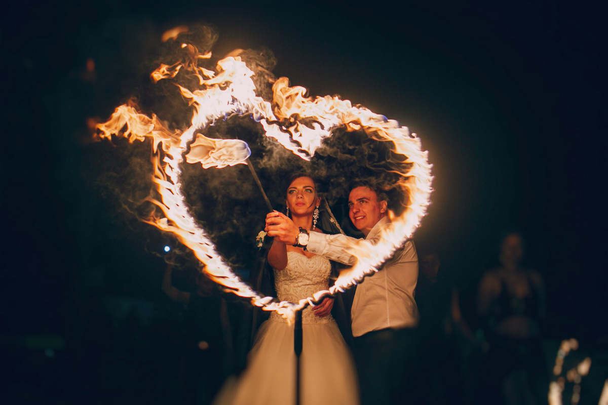 newlyweds-llighting-fire-hear.jpg